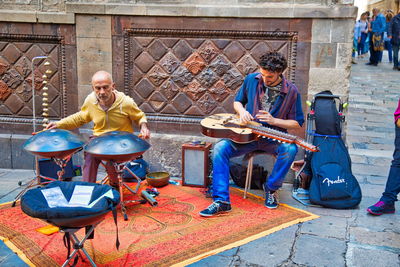 People playing guitar