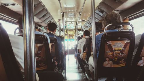 Rear view of people traveling in train