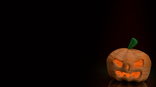 Close-up of pumpkin against black background