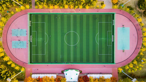 Close-up of green container on field