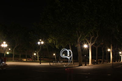 Illuminated street lights at night