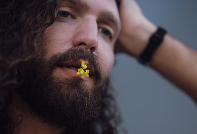 Close-up of young woman looking away