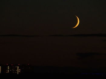 Scenic view of sea against sky at night