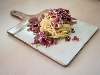 Close-up of  a plate of carbonara on table