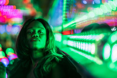 Cheerful black woman on funfair