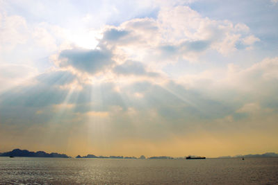 Scenic view of sea against cloudy sky