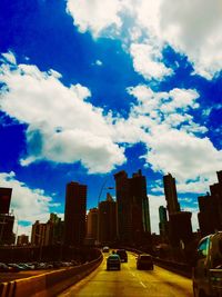 City street against cloudy sky