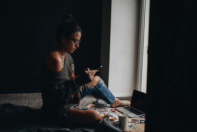 Young woman using mobile phone