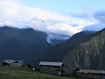 Scenic view of snowcapped mountains against sky