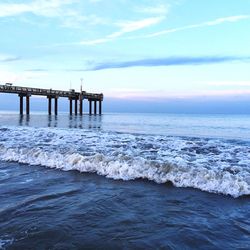 Scenic view of sea against cloudy sky