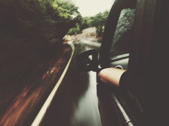Cropped image of car on road