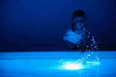 Young woman swimming in pool