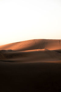 Scenic view of desert against clear sky