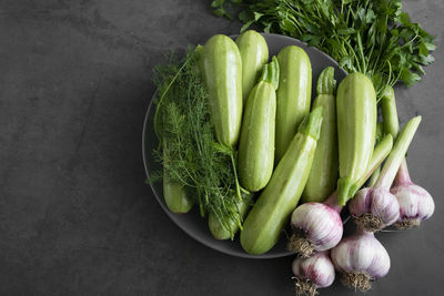 High angle view of vegetables on table against black background