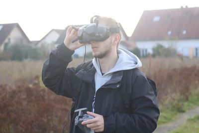 Young man wearing hat standing outdoors