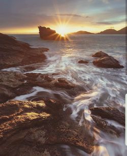 Scenic view of sea against sky during sunset