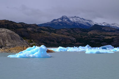 Scenic view of glaciers against cloudy sky, patagonia argentina