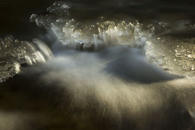 Close-up of water flowing through rocks