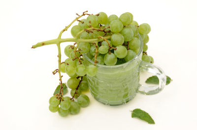 High angle view of berries on white background