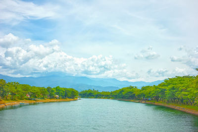 06/12/2020, a wide estuary with a beautiful mountain backdrop. padang, indonesia.