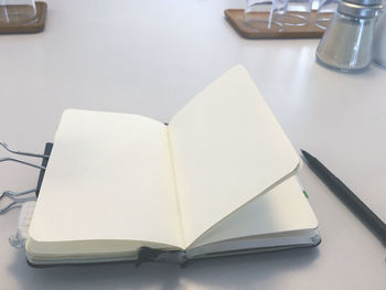 High angle view of open book on table