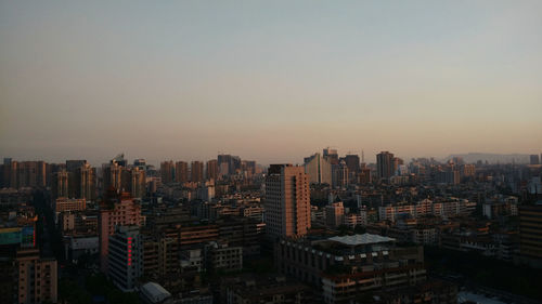 Aerial view of city at dusk