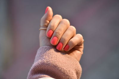 Close-up of woman hand with pink nails 