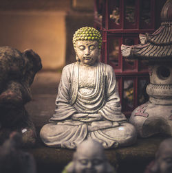 Statue of buddha against building