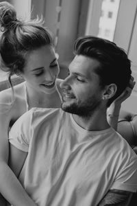 Portrait of young couple sitting
