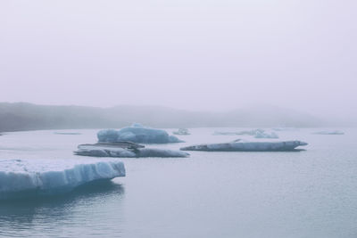 Scenic view of frozen sea against sky