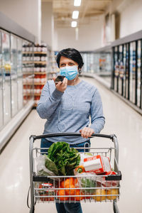 Man holding food in store