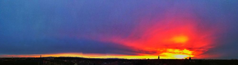 Silhouette city against sky during sunset