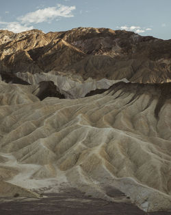 Scenic view of arid landscape against sky