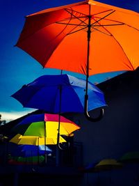 Low angle view of umbrella against sky during rainy season