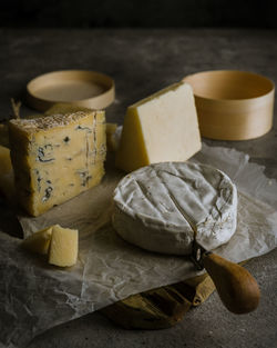 Variety of cheeses on dark background 