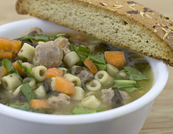 Close-up of soup served in bowl on table