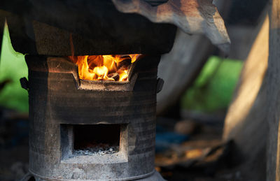 Close-up of fire burning on wood