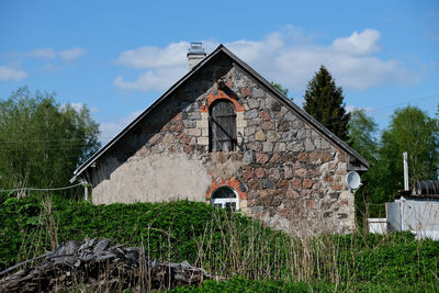 House on field against sky