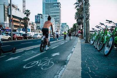 Man riding bicycle on city street