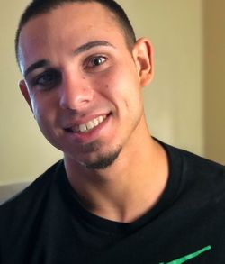 Close-up portrait of smiling young man
