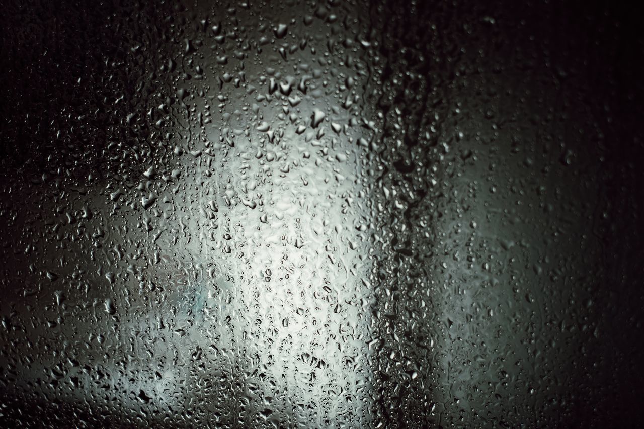 FULL FRAME SHOT OF RAINDROPS ON GLASS