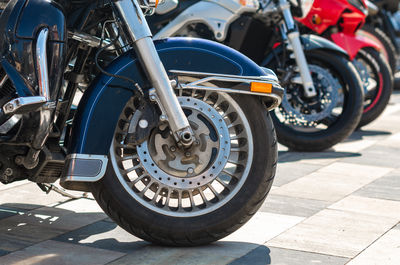 Close-up of motorcycle parked on street