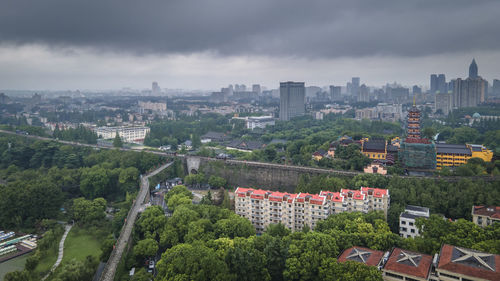 High angle view of buildings in city against sky