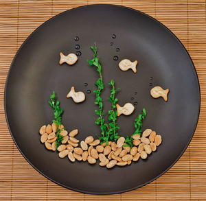 High angle view of vegetables in plate on table