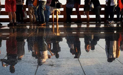 High angle view of people standing on floor