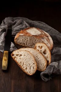 Close-up of bread on table against black background