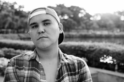 Portrait of young man standing outdoors