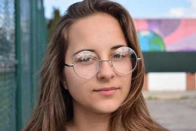 Close-up portrait of smiling young woman