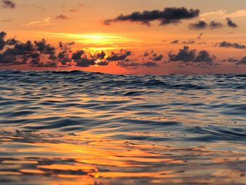 Scenic view of sea against romantic sky at sunset