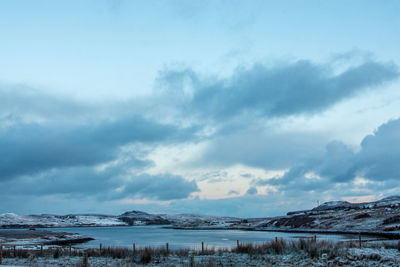 Scenic view of frozen lake against sky